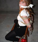 Lola is chair-tied and cleave-gagged