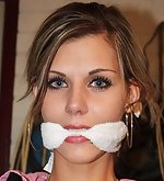 Irena cleave-gagged struggling to get out of her chair