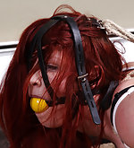 Redhead in her first hogtie bondage