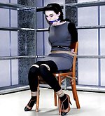 Hot brunette chair-tied and ball-gagged